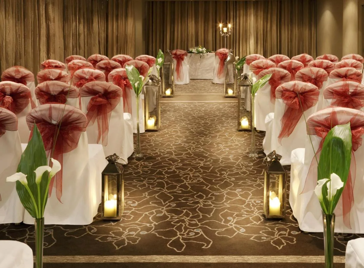 a set up for a wedding with red and white flowers at The Bristol Hotel in Bristol